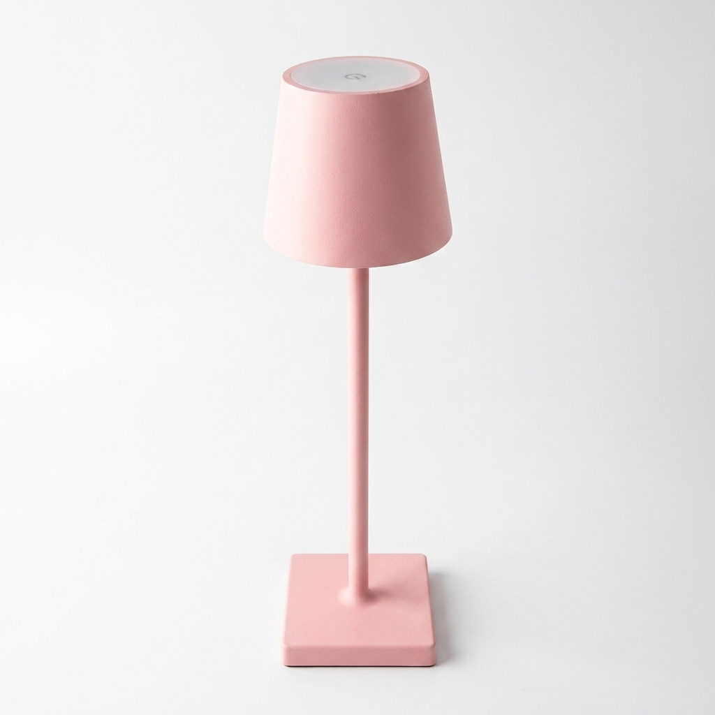 Rechargeable touch dimming table lamp in pink on a white studio background